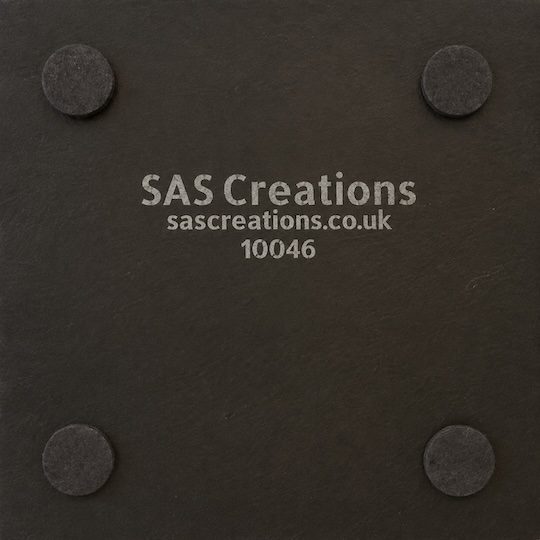Underside of the whisky slate coaster showing four protective feet and SAS Creations branding