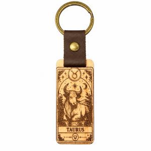 Taurus zodiac wooden keyring with engraved bull design, brown strap and antique brass-tone split ring.