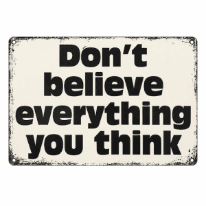 Don’t believe everything you think sign with black lettering, cream background and distressed edging.