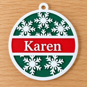 Personalised Christmas snowflake tree decoration with the name Karen